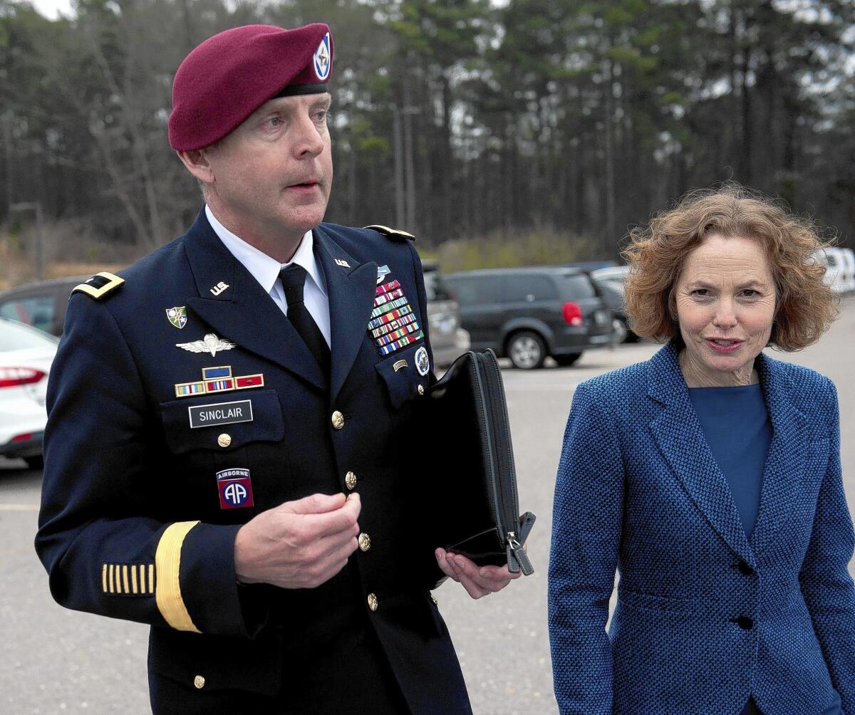 Army Brig. Gen. Jeffrey A. Sinclair leaves court with attorney Ellen Brotman. He pleaded guilty to mistreating his mistress and other charges.