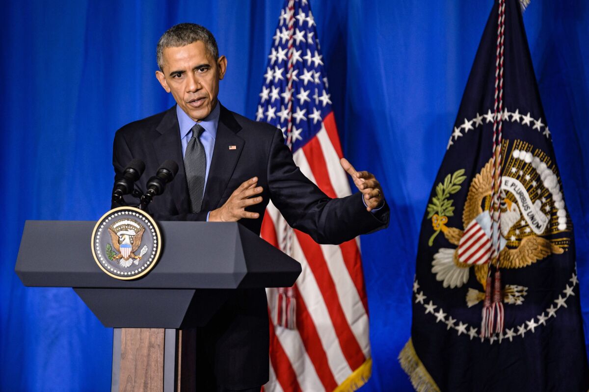 President Obama speaks during a news conference in Paris on Tuesday.