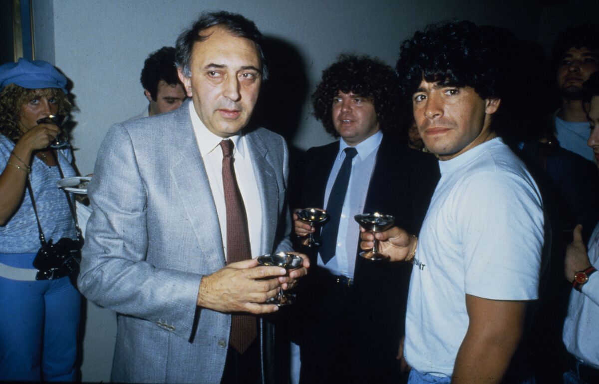 Diego Maradona is greeted by club president Corrado Ferlaino after joining Italian power Napoli in July 1984, when he was 23.