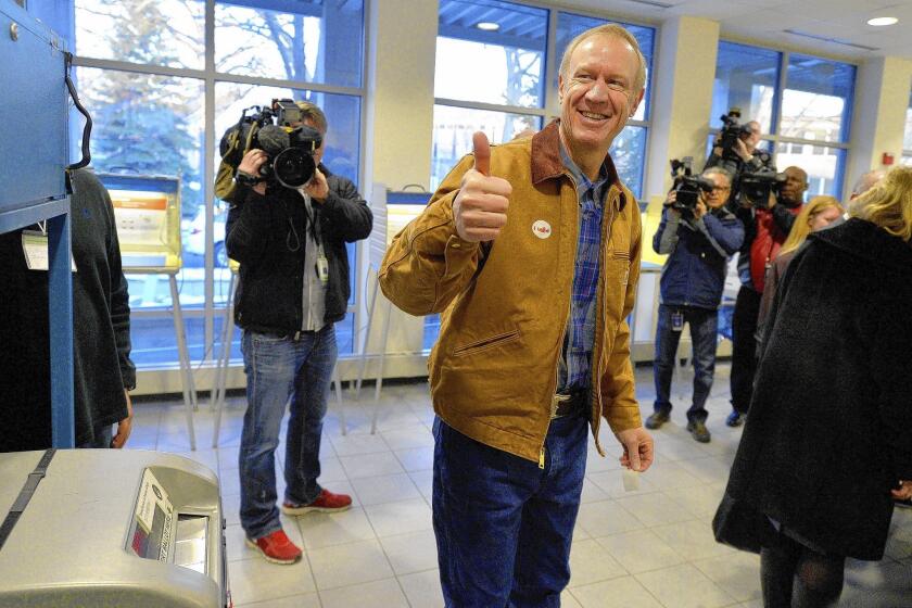 Gubernatorial candidate Bruce Rauner casts his ballot in the GOP primary in Winnetka, Ill. The venture capital tycoon has shown disdain for public employee unions, but it’s unclear whether they will back Gov. Pat Quinn.