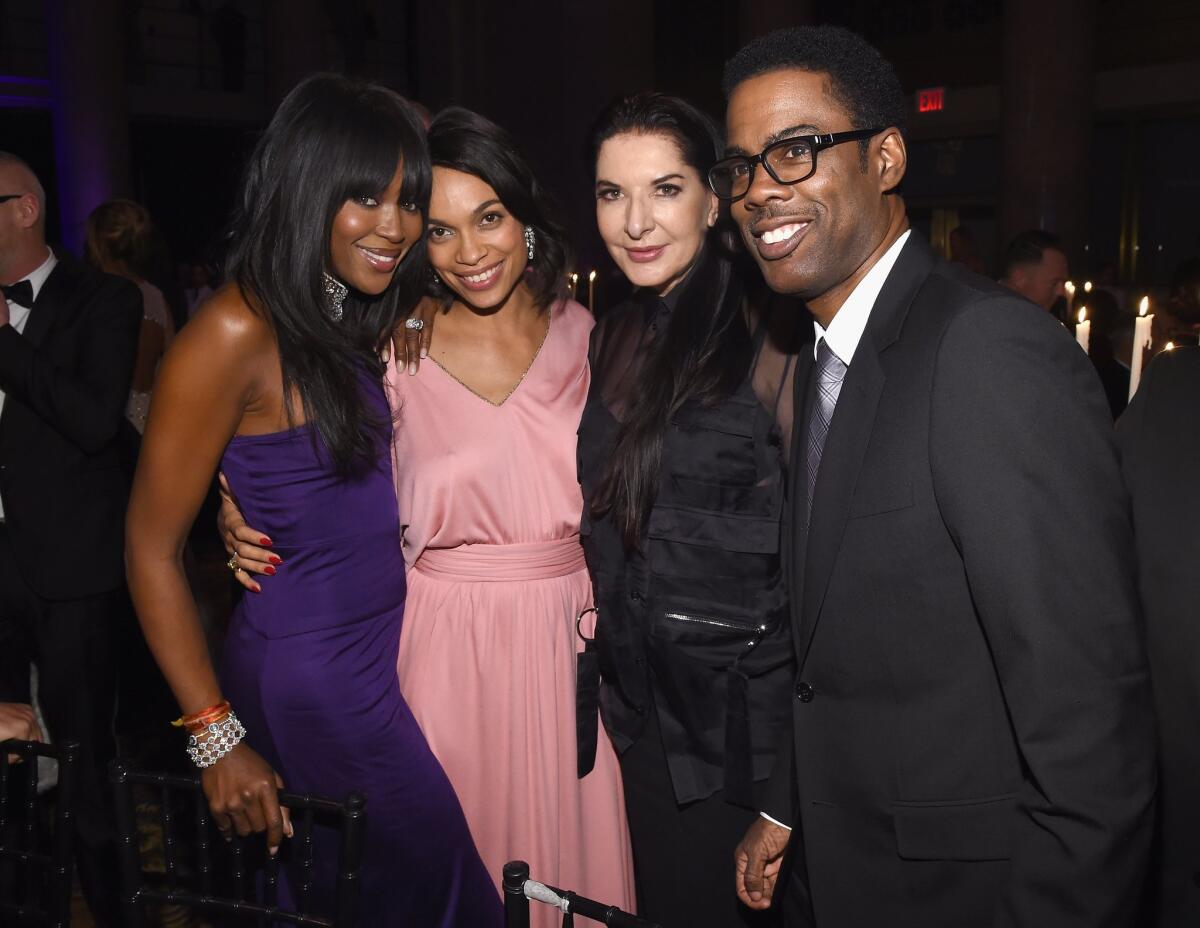 Naomi Campbell, left, Rosario Dawson, Marina Abramovic and Chris Rock attend the 2015 amfAR New York gala on Wednesday.