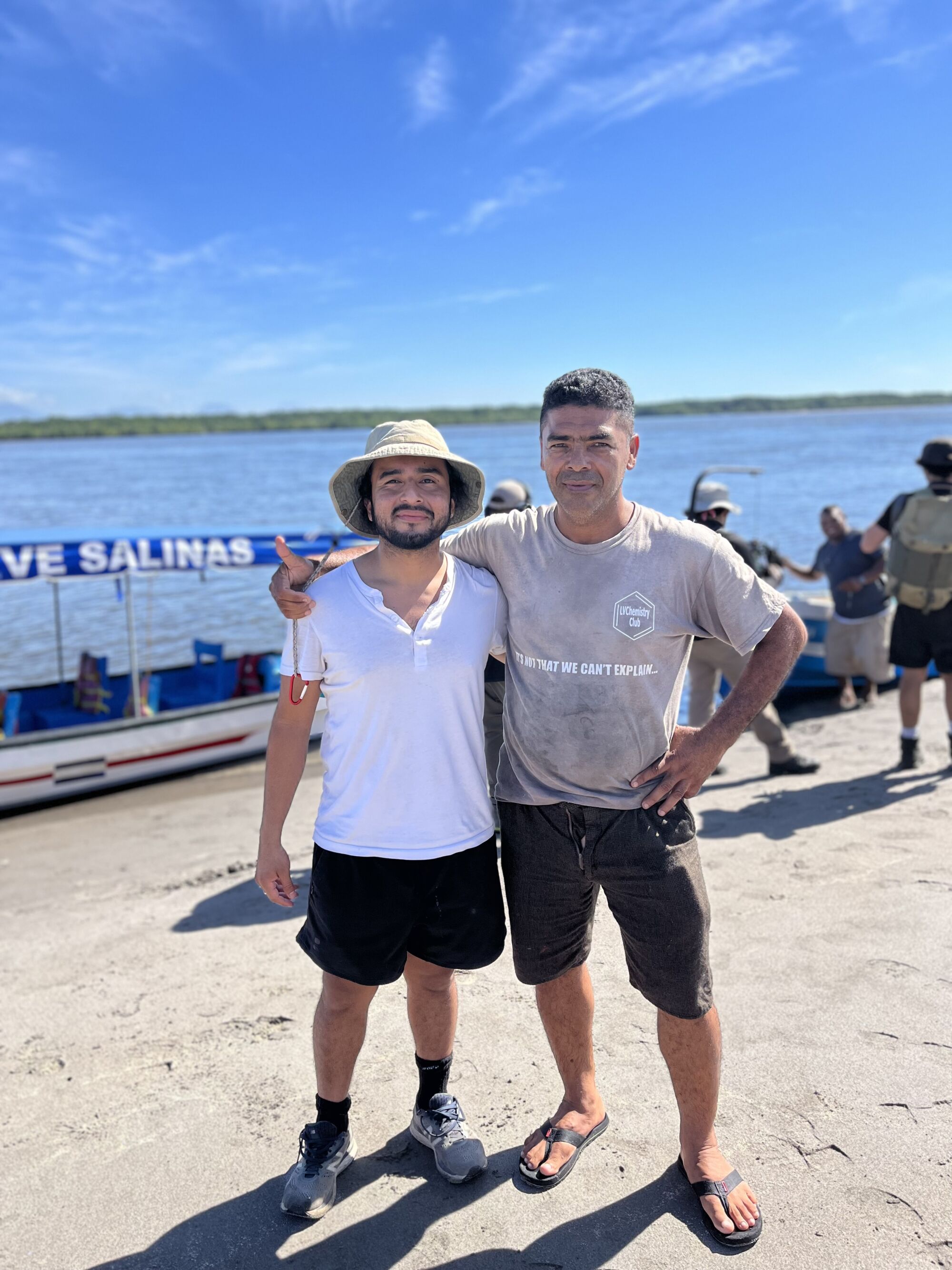 Javier Zamora and one of his dad's childhood friends at a pier