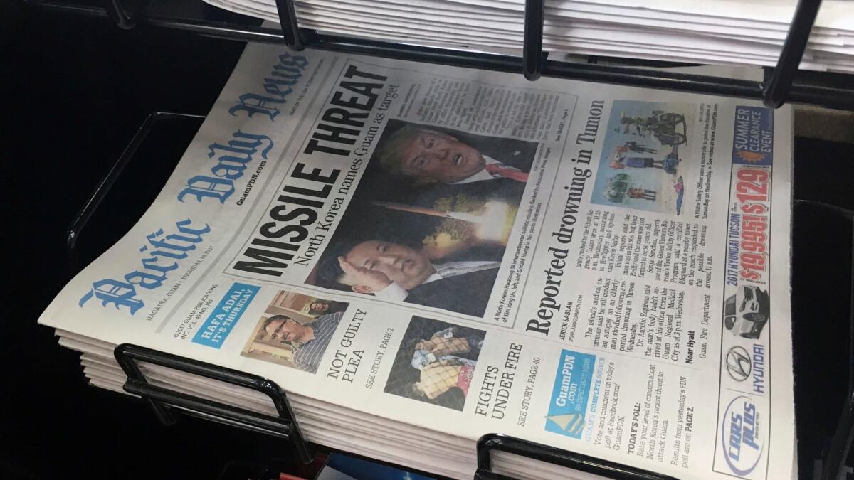 A copy of the local newspaper for sale in Hagatna, Guam on Aug. 10. (Tassanee Vejpongsa / Associated Press)