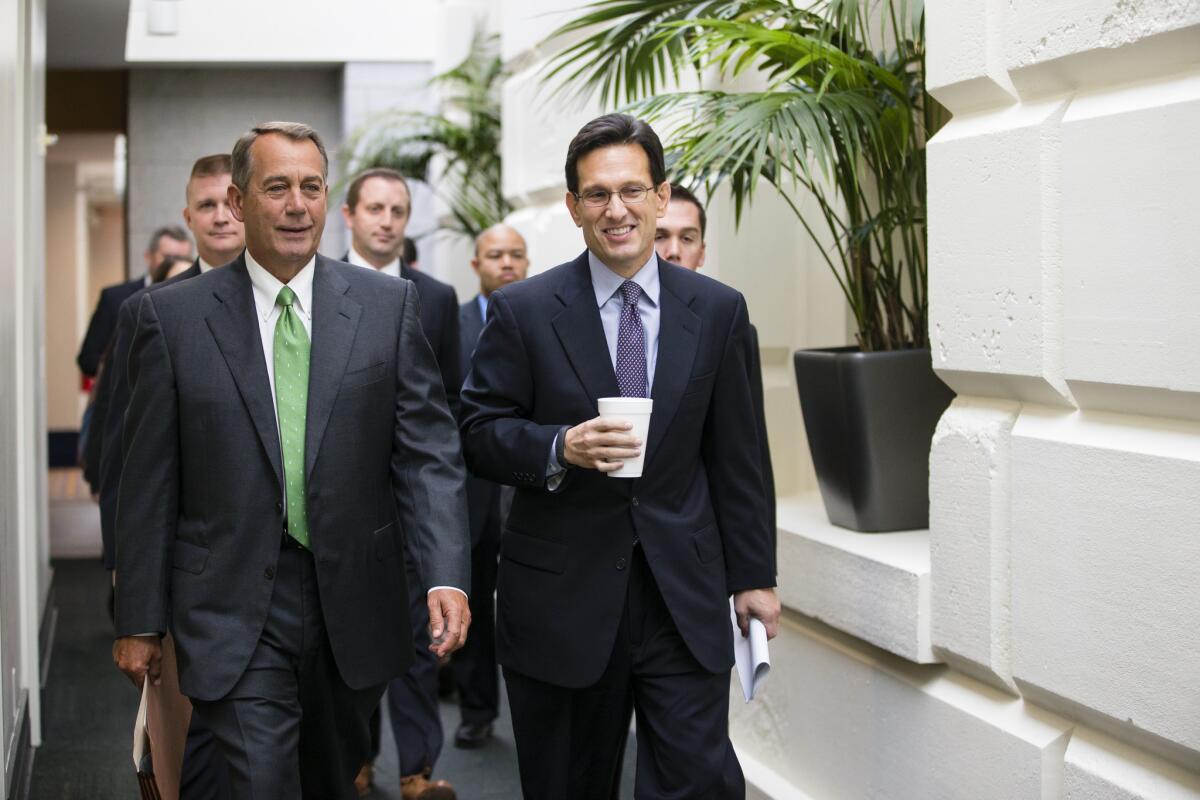 House Speaker John A. Boehner of Ohio, left, and House Majority Leader Eric Cantor of Virginia walk to a Republican caucus Thursday on Capitol Hill.