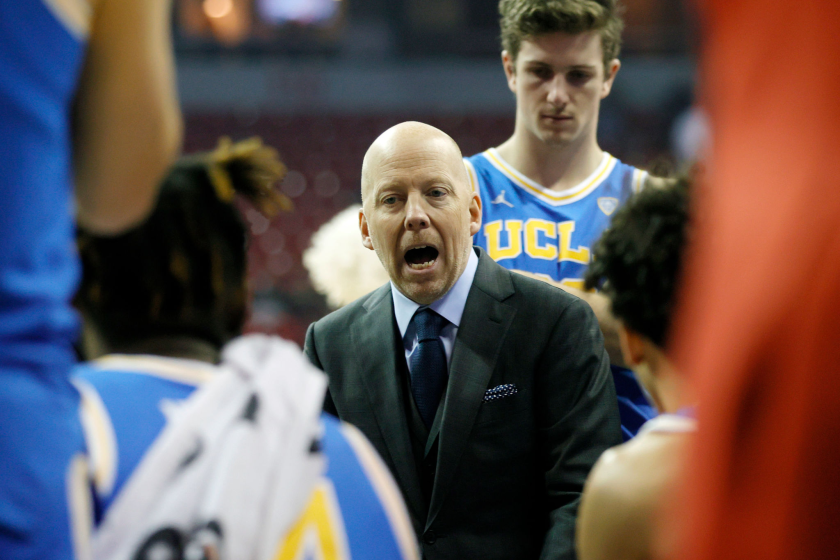 LAS VEGAS, NEVADA - NOVEMBER 27: Head coach Mick Cronin of the UCLA Bruins talks to his players during a timeout.