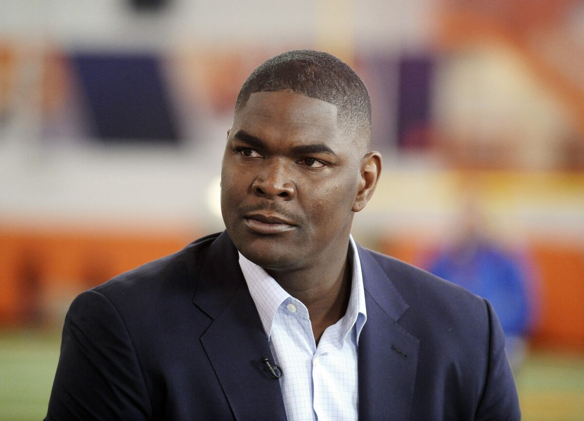 FILE - In this March 6, 2014, file photo, former NFL and Southern California receiver Keyshawn Johnson appears during the Clemson NCAA college football pro day in Clemson, S.C. In this era of racial reckoning, it is not only appropriate but significant that the stories of NFL trailblazers be told. Johnson, the 1997 top overall draft pick by the New York Jets and now host of ESPN's morning program, has done so. Collaborating with Bob Glauber, the Newsday columnist and 2021 recipient of the Bill Nunn Jr. Award by the Pro Football Writers of America for outstanding long-time reporting, Johnson has authored “Forgotten First.” (AP Photo/Rainier Ehrhardt, File)