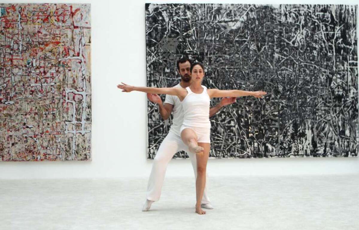LA Dance Project's Benjamin Millepied performs at MOCA in July with dancer Amanda Wells in front of paintings by Mark Bradford.