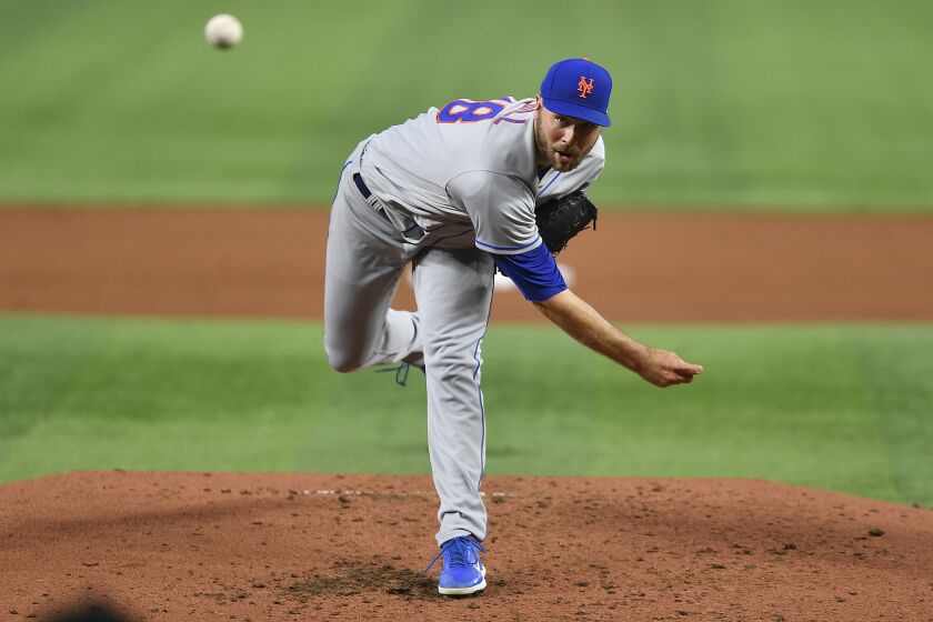 New York Mets starter Tylor Megill delivers a pitch during the second inning of a baseball game against the Miami Marlins, Saturday, April 1, 2023, in Miami. (AP Photo/Michael Laughlin)