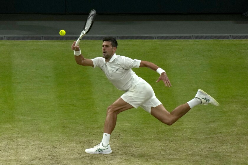 Novak Djokovic returns the ball to Tim van Rijthoven at Wimbledon.
