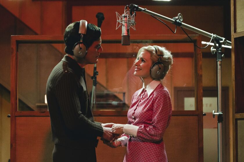 This image released by Showtime shows Michael Shannon as George Jones, left, and Jessica Chastain as Tammy Wynette in a scene from "George & Tammy," premiering Dec. 4. (Dana Hawley/Showtime via AP)