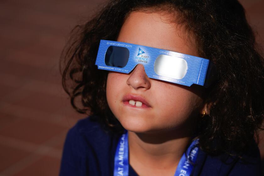 San Diego, CA - October 14: On Saturday, Oct. 14, 2023, in San Diego, CA, Talie Izacard was among the hundreds who came out to Balboa Park to observe the solar eclipse. (Nelvin C. Cepeda / The San Diego Union-Tribune)