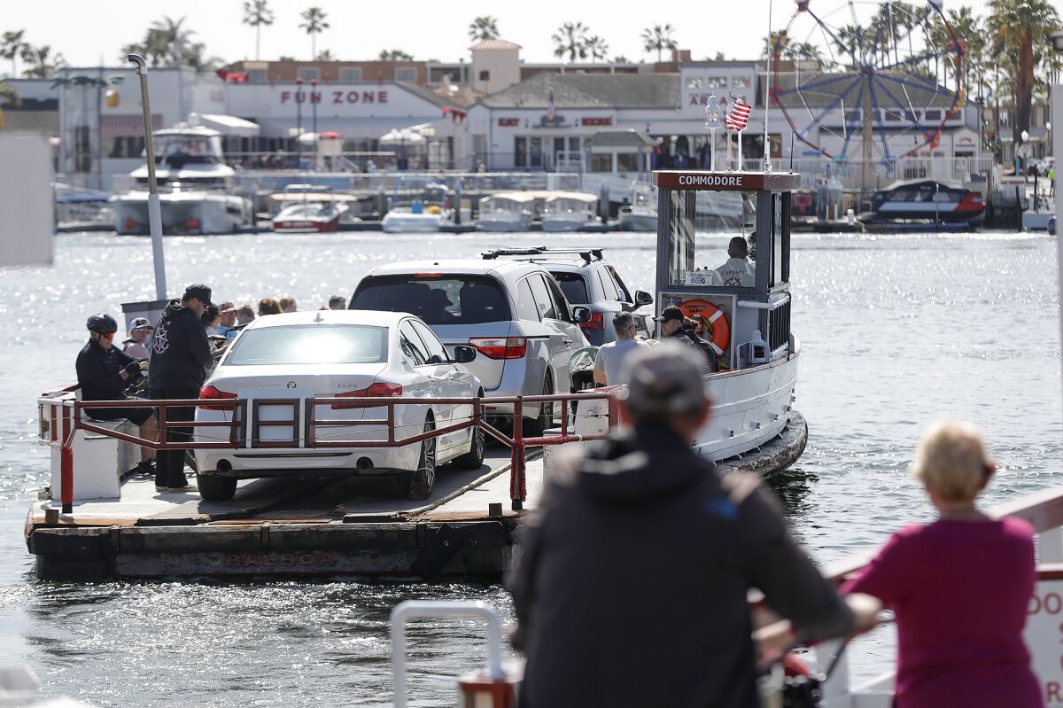 The Balboa Island ferry transports cars and people across the Newport Harbor. 