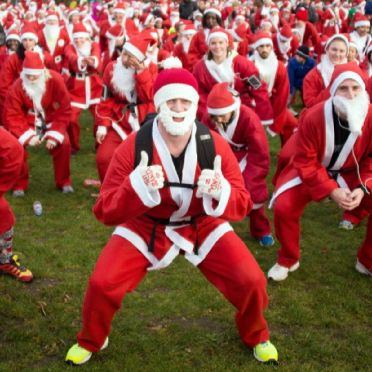 A crowd of Santas gathers for a Christmas race.