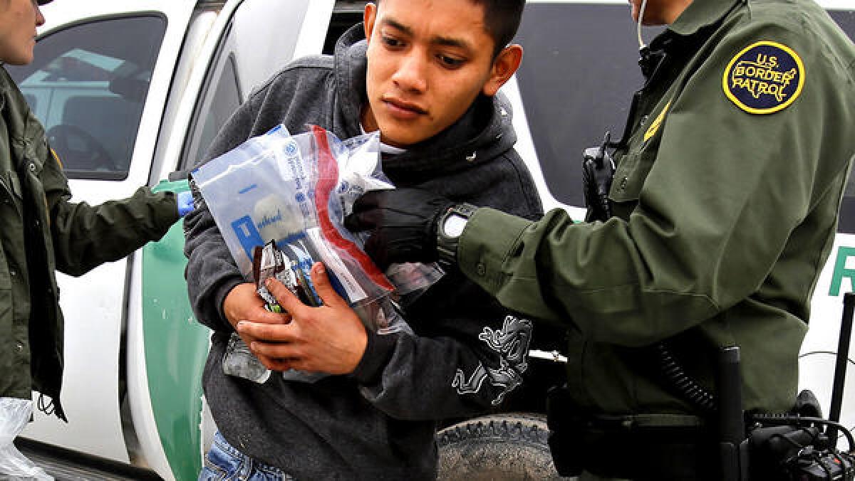 A 17-year-old Guatemalan gets out of a U.S. Border Patrol vehicle south of McAllen, Texas.