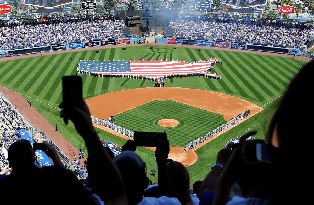The Dodgers' 2015 opener unfolds at Dodger Stadium. They'll begin this season Sunday against the Padres in San Diego.