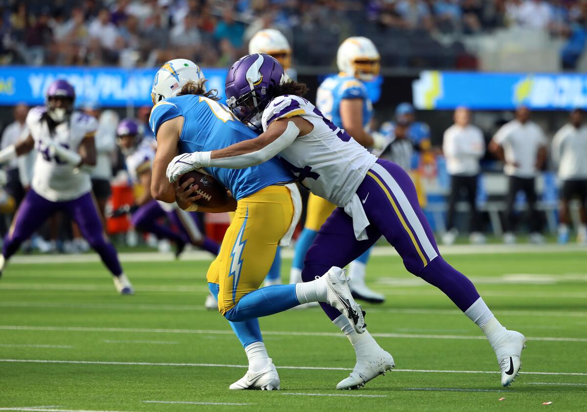 Eric Kendricks of the Vikings sacks Justin Herbert of the Chargers during the first quarter Sunday.