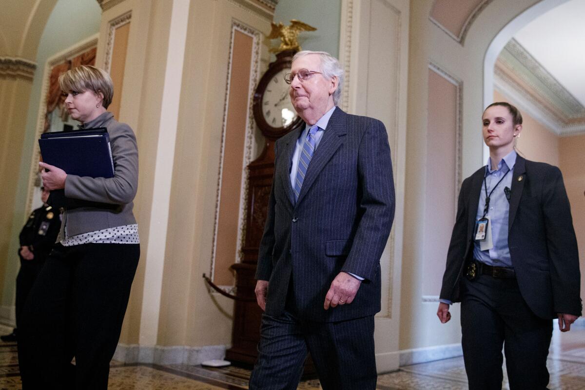 Senate Majority Leader Mitch McConnell walks to the Senate floor before the vote on calling witnesses on Jan. 21. 
