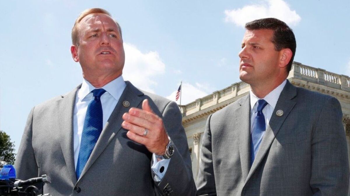 Rep. Jeff Denham (R-Turlock), left, speaks next to Rep. David Valadao (R-Hanford) during a news conference on Capitol Hill.