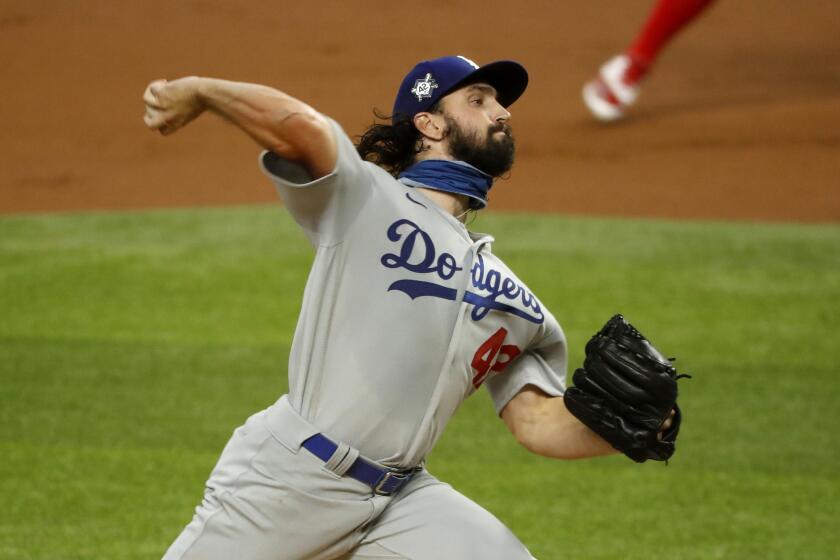 Los Angeles Dodgers starting pitcher Tony Gonsolin throws during the first inning of a baseball game against the Texas Rangers in Arlington, Texas, Sunday, Aug. 30, 2020. (AP Photo/Roger Steinman)