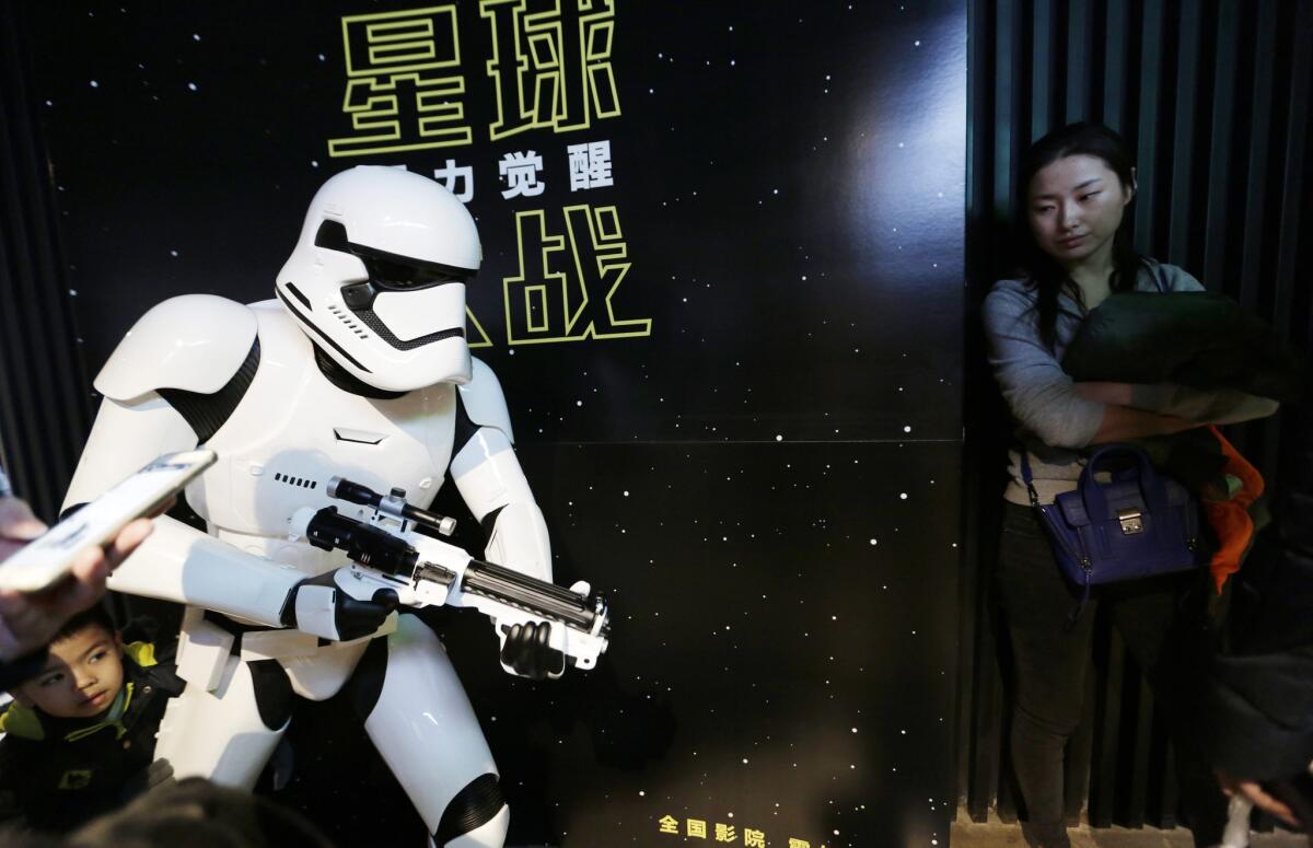 “Star Wars: The Force Awakens” earned $44 million last week at the Chinese box office. Above, filmgoers at a cinema in Beijing.