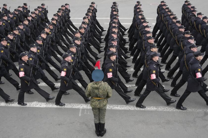 Troops march during a rehearsal for the Victory Day military parade which will take place at Dvortsovaya (Palace) Square on May 9 to celebrate 77 years after the victory in World War II in St. Petersburg, Russia, Thursday, May 5, 2022. (AP Photo/Dmitri Lovetsky)