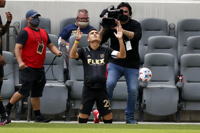 Los Angeles FC midfielder Eduard Atuesta (20) celebrates his goal against the Seattle Sounders during the first half of an MLS soccer match, Saturday, April 24, 2021, in Los Angeles. (AP Photo/Ringo H.W. Chiu)