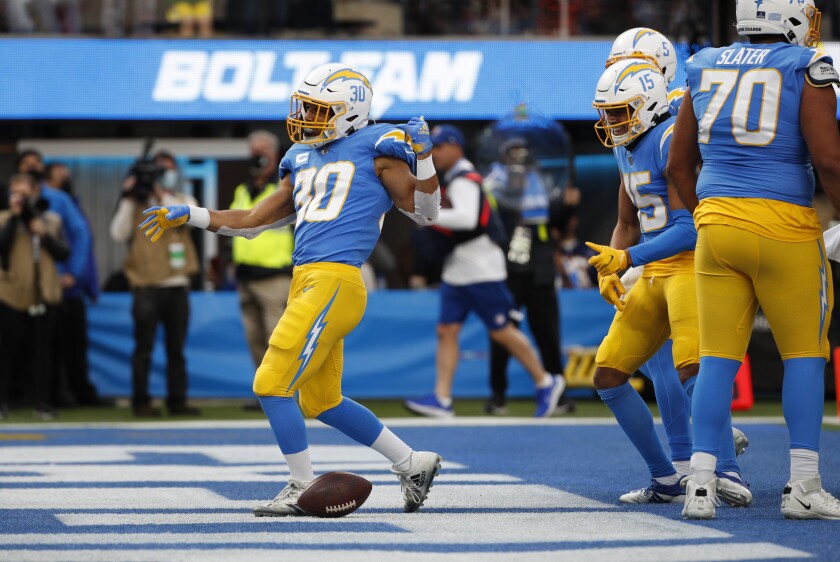Chargers running back Austin Ekeler celebrates after scoring a first-half touchdown against the Broncos.