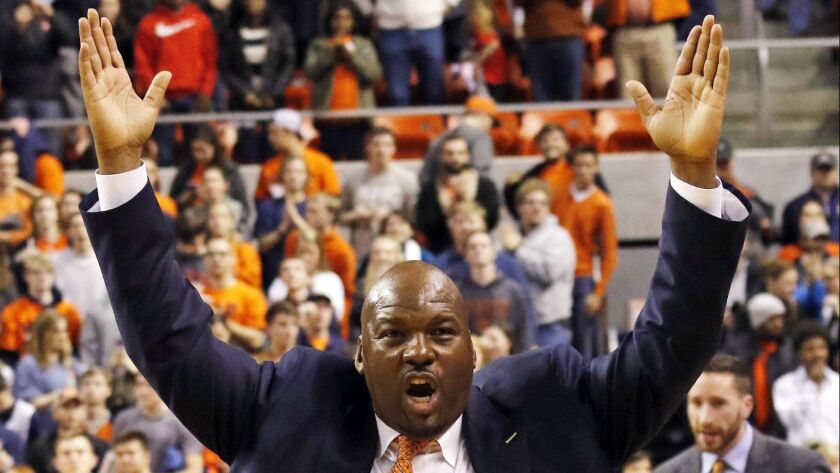 In this Jan 19, 2016, file photo, Auburn assistant coach Chuck Person celebrates after they defeated Alabama 83-77 in Auburn, Ala.