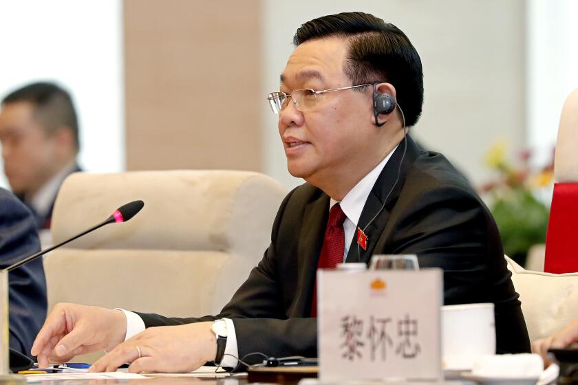 FILE - Vietnamese Chairman of the National Assembly Vuong Dinh Hue speaks to Chinese President Xi Jinping during a meeting at the national assembly in Hanoi, Vietnam, Wednesday, Dec. 13, 2023. Vietnamese state media outlet VN Express reports that the head of Vietnam’s Parliament, Vuong Dinh Hue, has resigned. He is the latest member of senior government to leave office amid an ongoing anti-corruption campaign. (AP Photo/Minh Hoang, Pool, File)