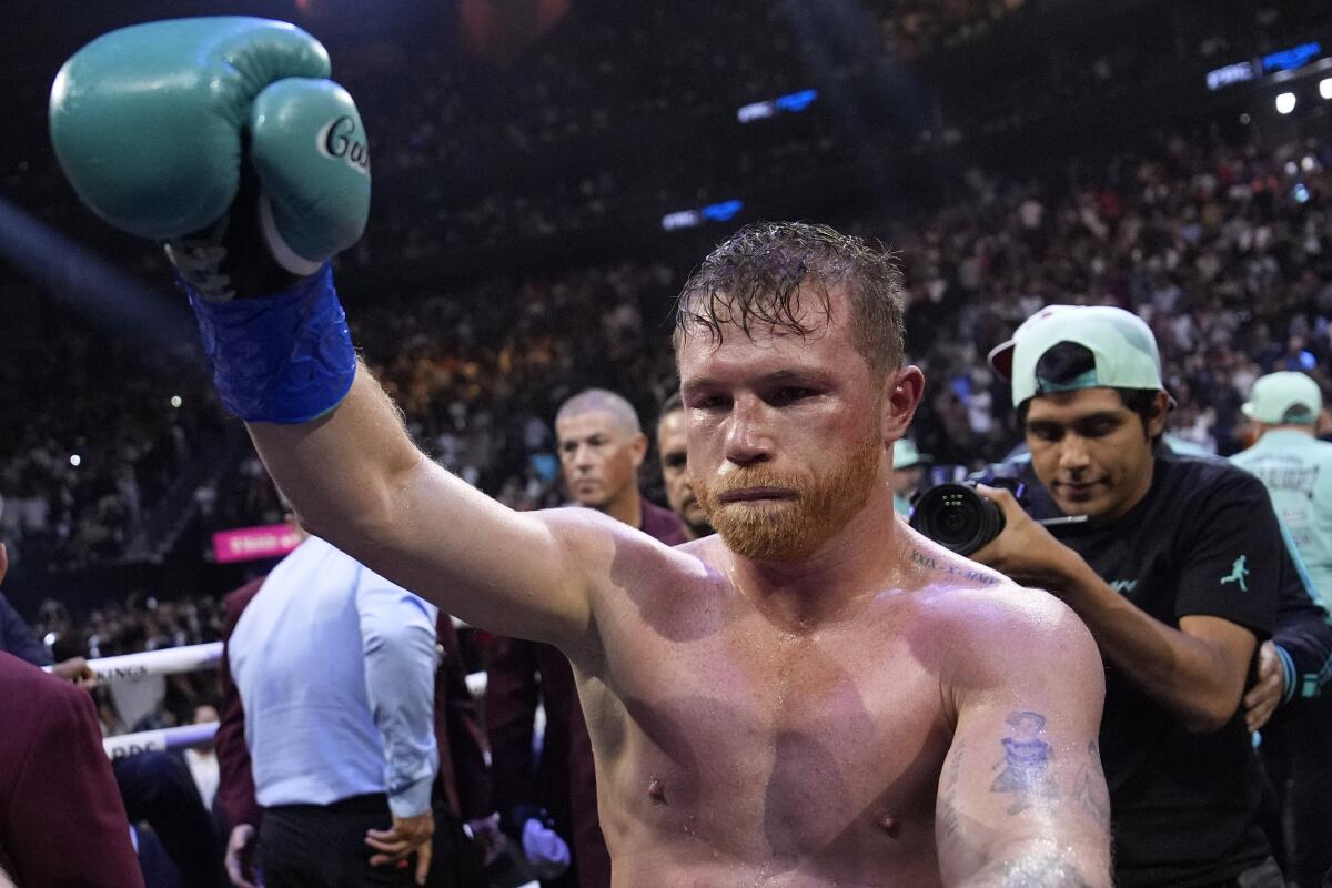 Canelo ?lvarez celebrates immediately after defeating Jaime Munguia in their super middleweight title fight Saturday night.