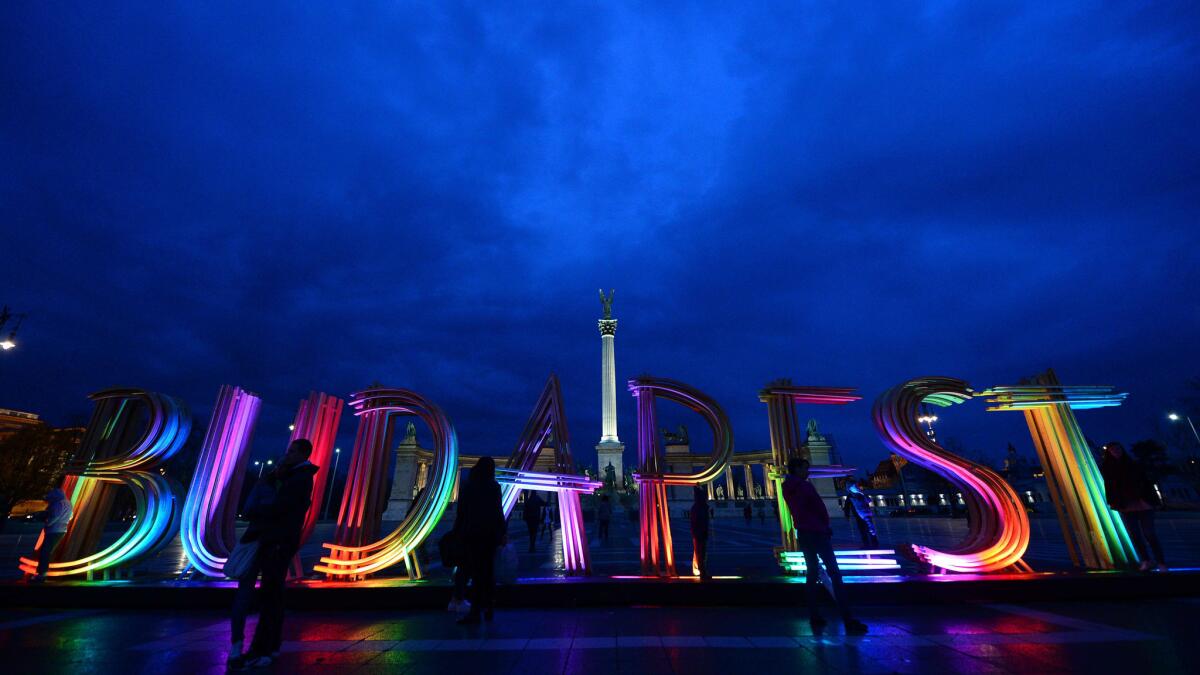 An illuminated "Budapest" sign is displayed at Heroes Square in Budapest on March 23, 2014.
