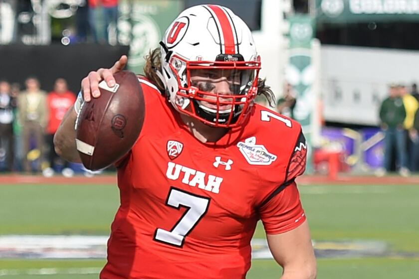 Utah quarterback Travis Wilson scores a touchdown during a 45-10 win over Colorado State at the Las Vegas Bowl on Saturday.