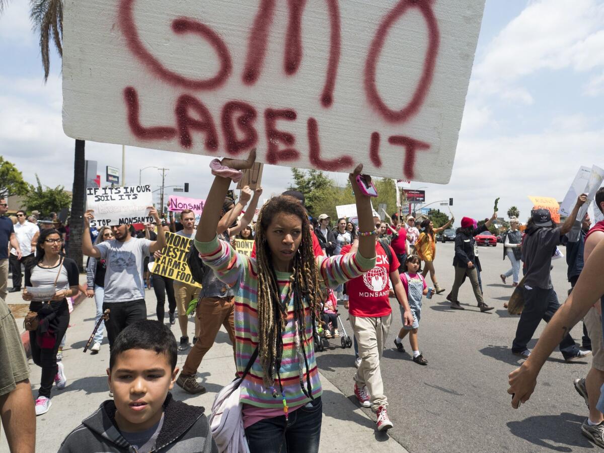 Activists take part in a march against US agrochemical giant Monsanto and GMO food products on May 23, in Los Angeles.