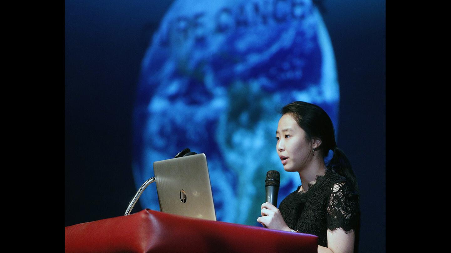 Student Priscilla Kang gives a speech called "What if You Could Change the World?" at a new student-run program called Ignite at La Canada High School on Friday, February 2, 2018. A mixture of ten students and teachers were given five minutes and twenty slides to give a presentation of their choice. Some made a speech with slides, while others performed.