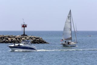 Boats cruise in and out of Oceanside Harbor Friday, 07/10/20. photo by Bill Wechter