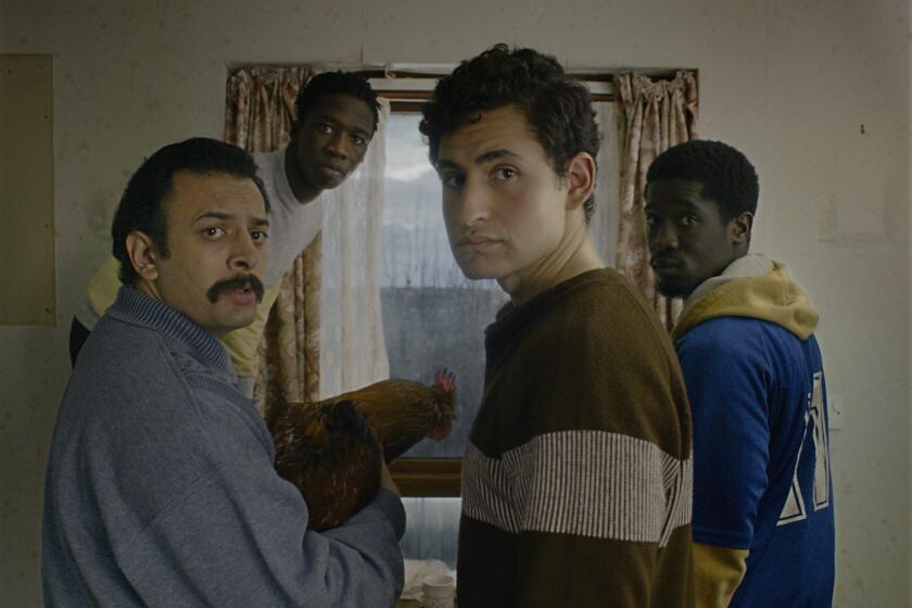 (L to R) Vikash Bhai as "Farhad", Kwabena Ansah as "Abedi", Amir El-Masry as "Omar", and Ola Orebiyi as "Wasef" in director Ben Sharrock's LIMBO, a Focus Features release.