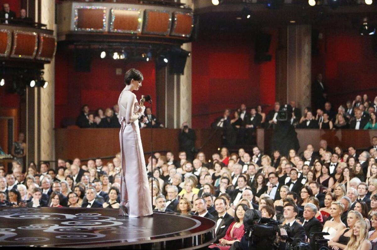 Anne Hathaway holds her Oscar for supporting actress in "Les Miserables" on Sunday at the Dolby Theatre.