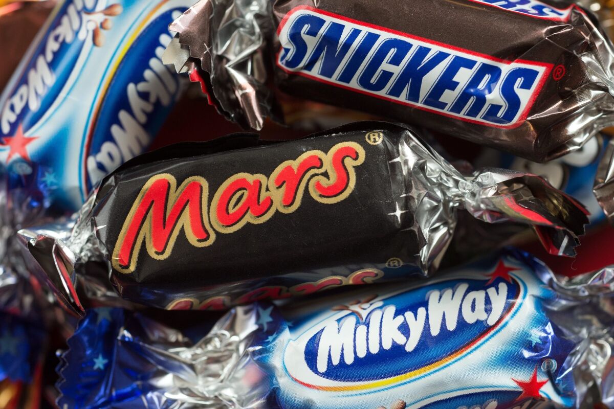 Mars has committed to spending $1 billion on a program to overhaul its chocolate supply chain. Critics are skeptical of such big-company efforts.