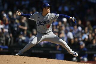 Los Angeles Dodgers starter Yoshinobu Yamamoto delivers a pitch during the first inning.