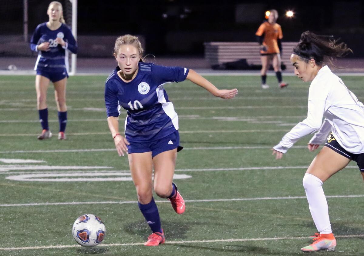 Newport Harbor's Antonella Russo (10) dribbles up field against Capistrano Valley on Wednesday.