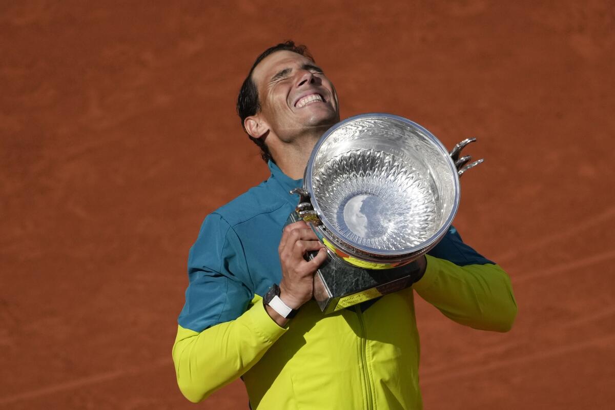 Spanish tennis player Rafael Nadal lifting a trophy