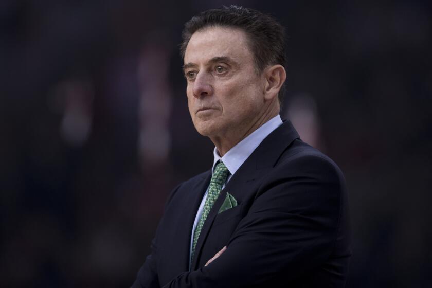 in this Friday, Jan. 4, 2019, file photo Former Panathinaikos coach Rick Pitino looks on during a Euroleague basketball match, between Panathinaikos and Olympiakos in Piraeus near Athens. Greece's Basketball Federation says U.S. coaching great Rick Pitino has agreed to coach the national team and lead its effort to qualify for the 2020 Olympics in Tokyo. Pitino would be officially presented Monday, when details of his agreement would be announced. (AP Photo/Petros Giannakouris, file)