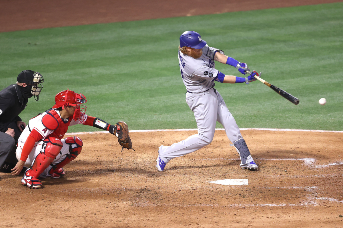 Dodgers third baseman Justin Turner hits a run-scoring double against the Angels during the Dodgers' 14-11 win.
