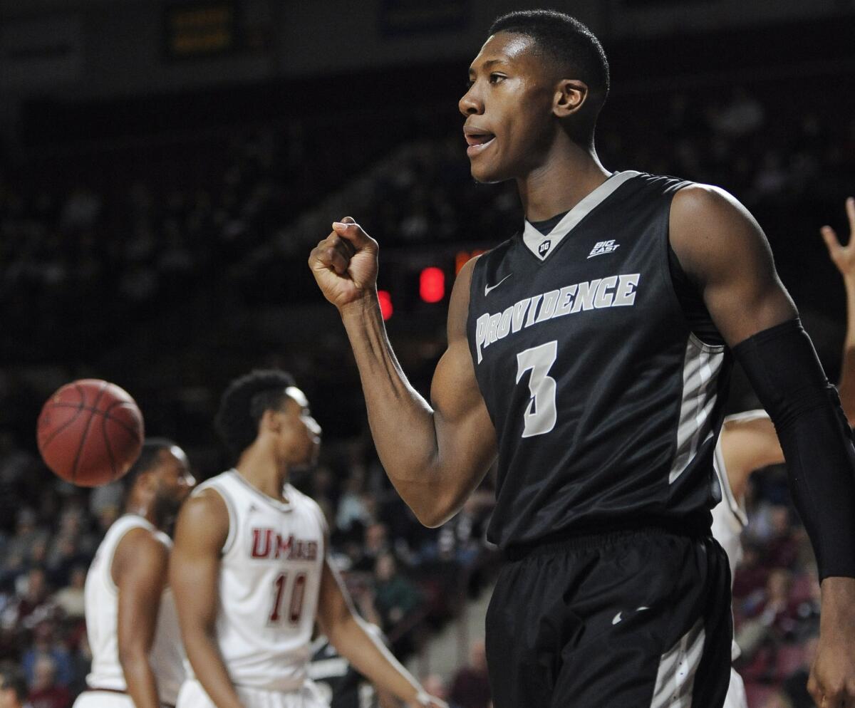Providence forward Kris Dunn reacts in the first half a game against Massachusetts.