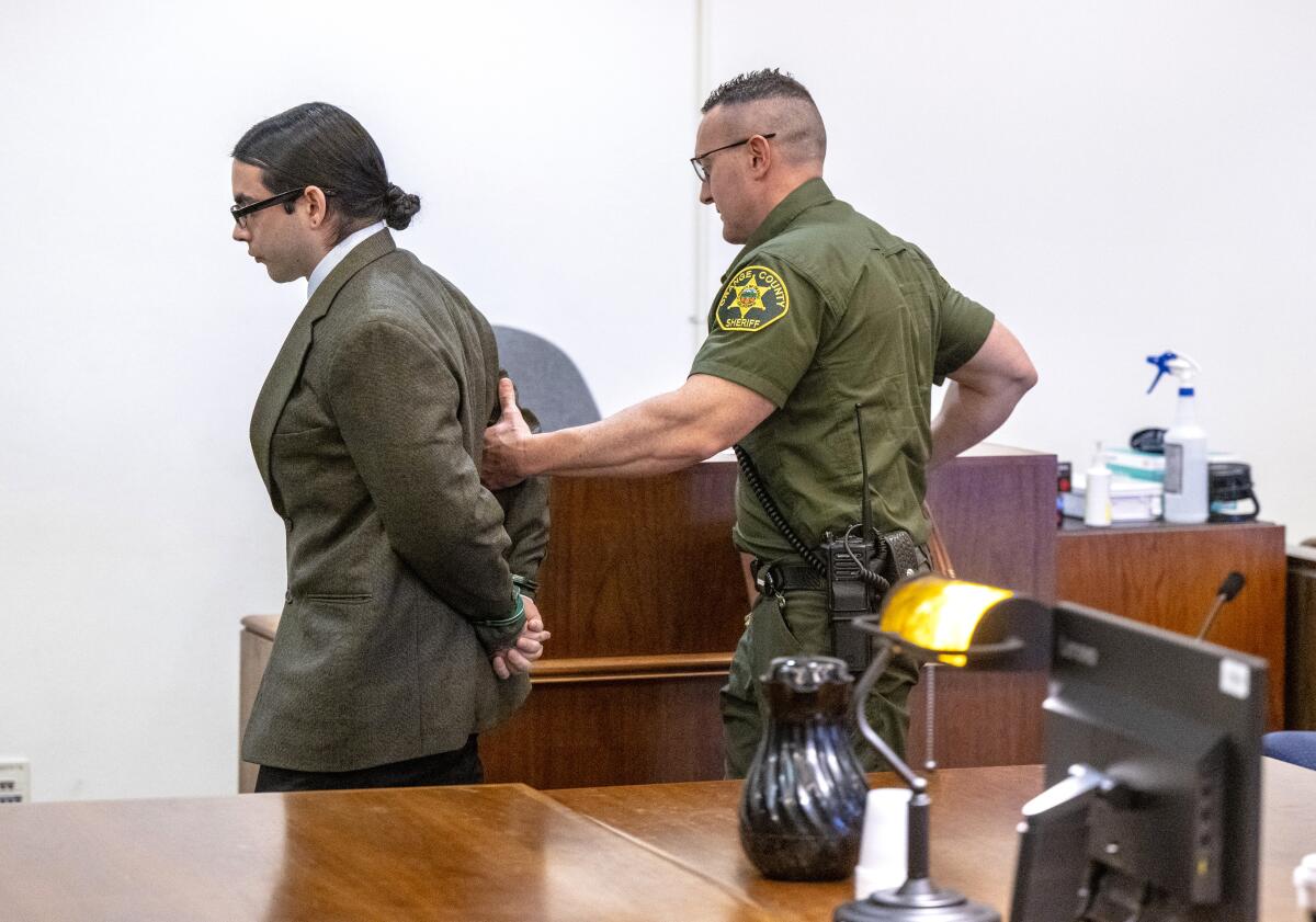 Marcus Eriz is escorted from court by a deputy after his sentencing Friday.