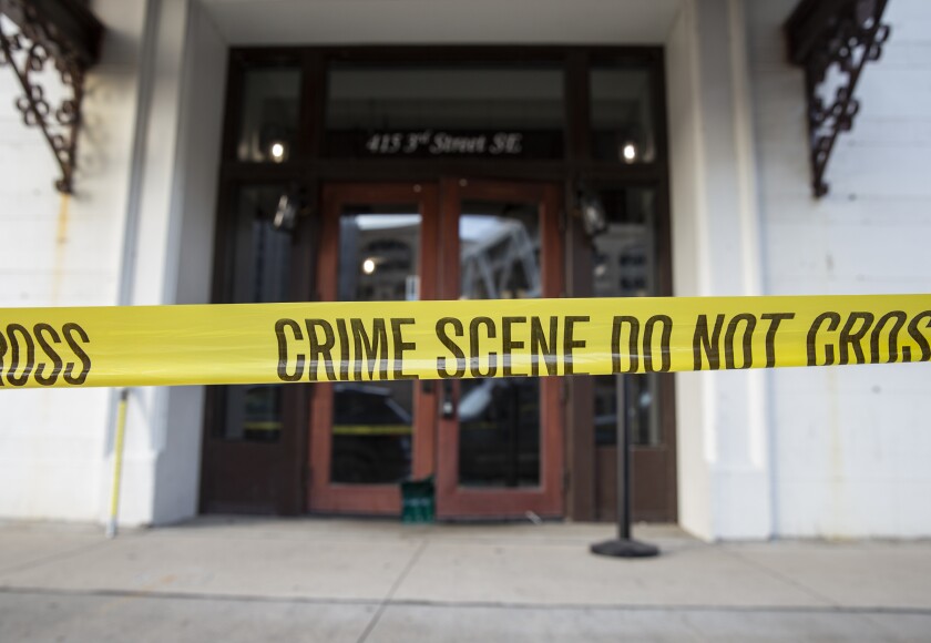 Crime scene tape blocks off the Taboo Nightclub and Lounge in Cedar Rapids, Iowa on Sunday, April 10, 2022. A shooting occurred at 1:27 A.M. that left ten people injured and two dead. One of the injuries remains critical and the other nine range from serious to minor. (Savannah Blake/The Gazette via AP)