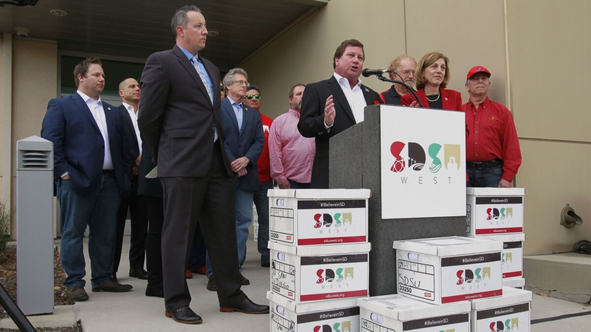 In this file photo from Jan. 16, 2018, Friends of SDSU steering committee member Fred Pierce speaks before he and other supporters submit boxes of the more than 106,000 signatures by San Diego voters for the SDSU West Initiative.