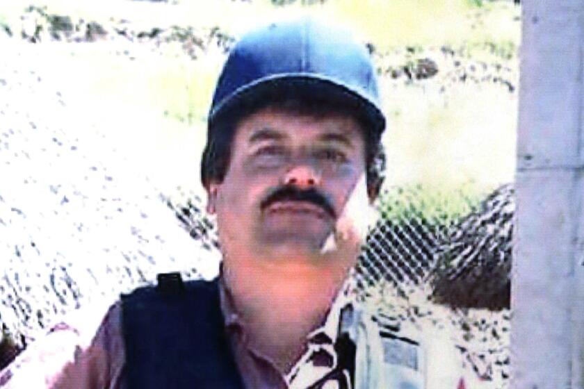 Portion of a poster depicting Joaquin "El Chapo" Guzman displayed at a Chicago Crime Commission news conference in 2013.
