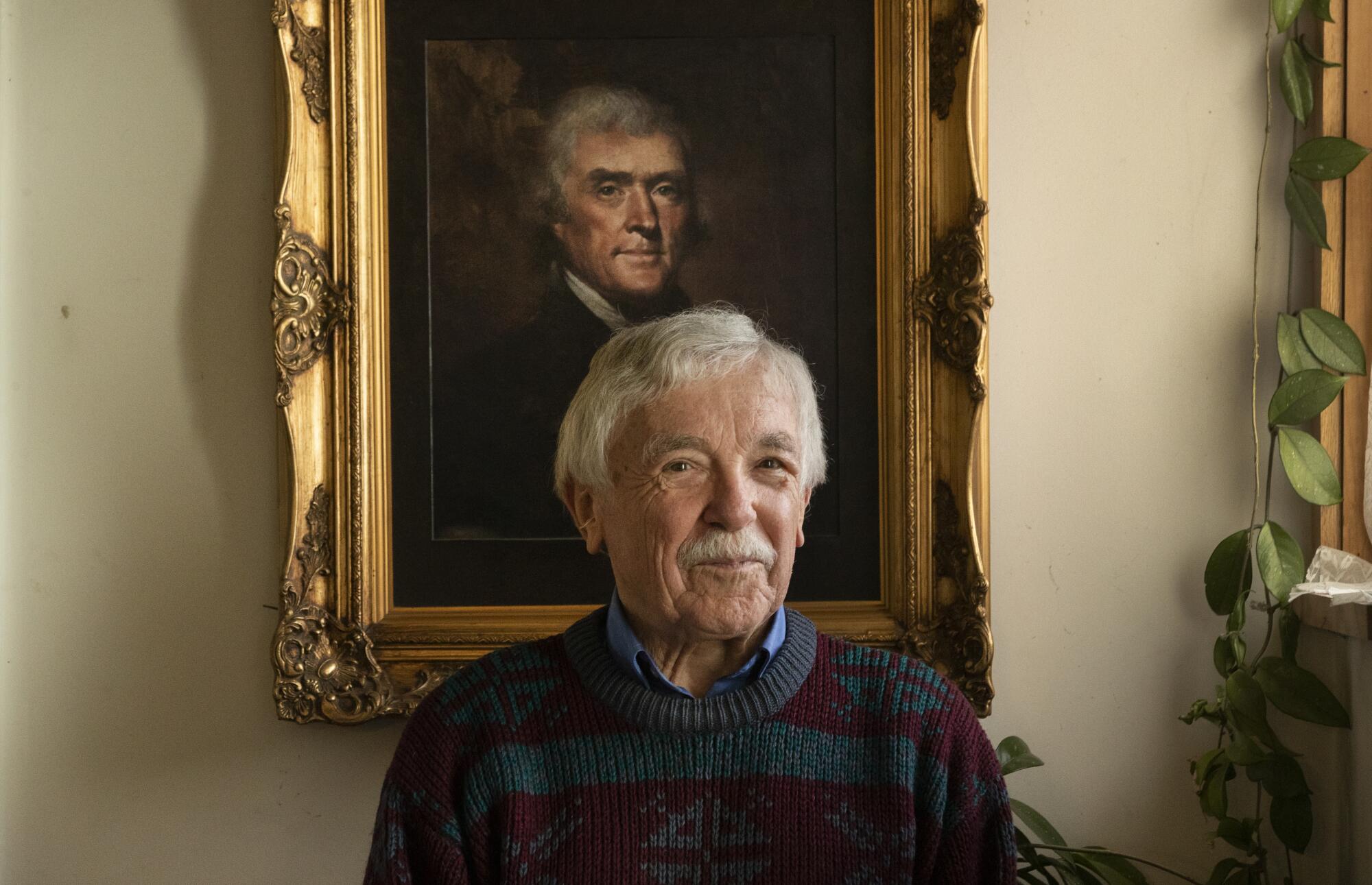 Sisson with a framed copy of Thomas Jefferson’s official presidential portrait.