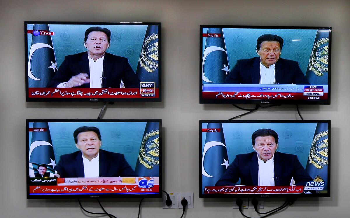 Various Pakistani news channels broadcast a live address to the nation by Pakistan's Prime Minister Imran Khan, at the office of The Associated Press, in Islamabad, Pakistan Thursday, March 4, 2021. Khan on Thursday announced he would seek a vote of confidence from the National Assembly this weekend to prove he still has the support of majority lawmakers in the house, despite the surprising and embarrassing defeat of his ruling party's key candidate in Senate's elections. (AP Photo/Anjum Naveed)